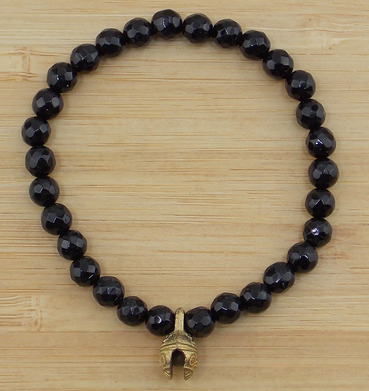 Pulsera de Ónix de 6mm con cascabel