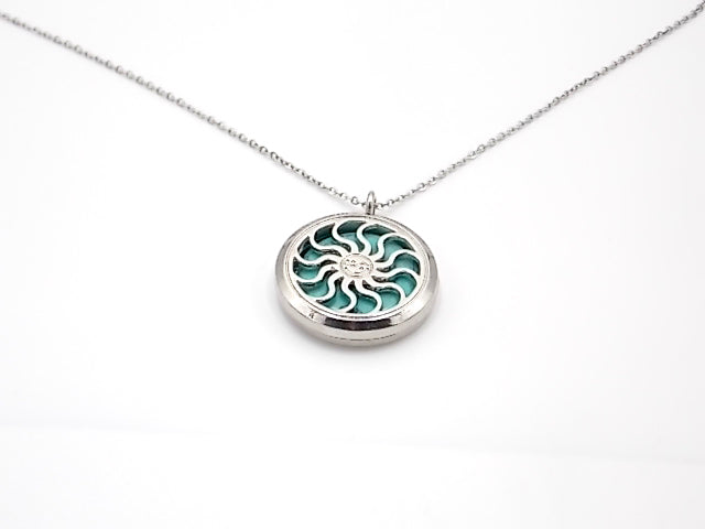 Colgante con motivo de Sol con una piedra de Turquesa