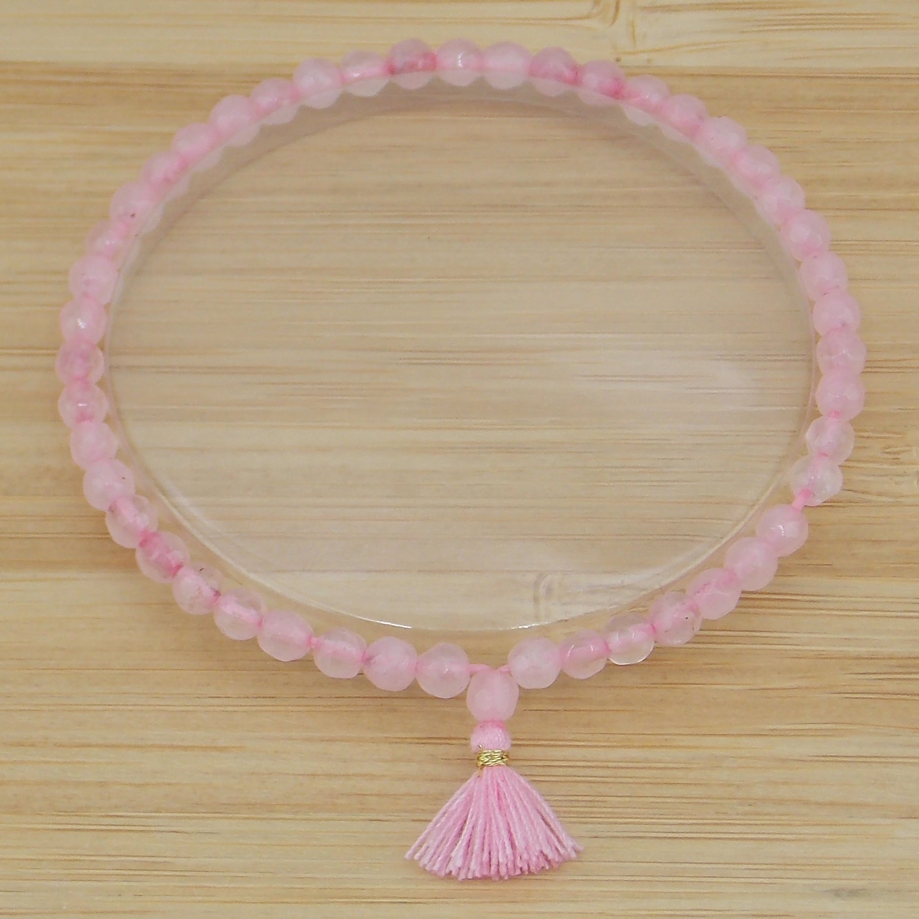 Pulsera de Cuarzo rosa facetada de 4mm con borla