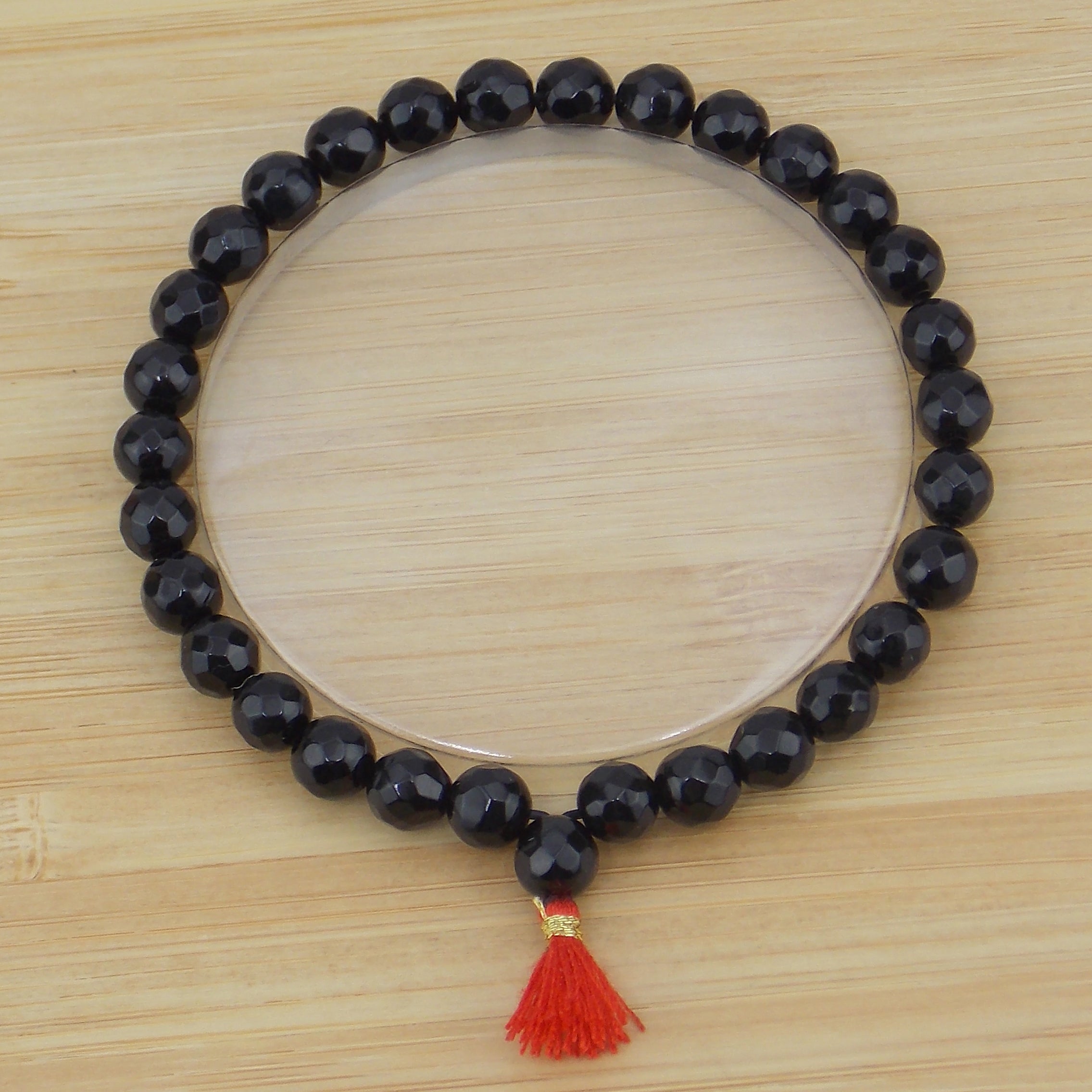 Pulsera de piedra natural de Ónix facetada de 6mm con borla