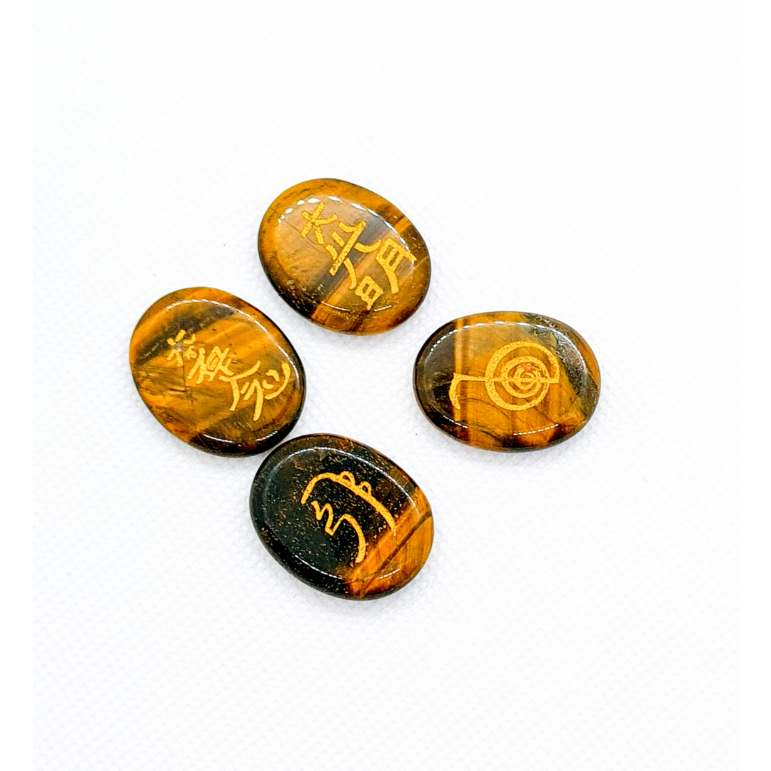 Conjunto de piedras con símbolos de Reiki en Ojo de tigre